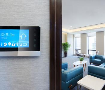 an image of a smart home tablet mounted on a wall