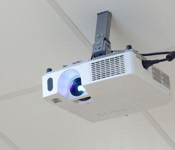 photo of a projector that is installed in a ceiling